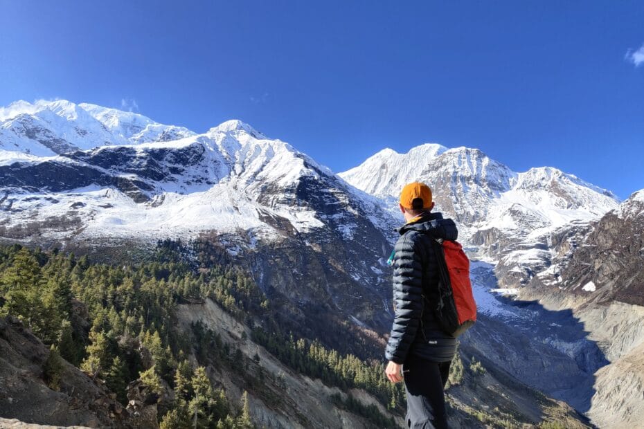 A trekker using the Osprey Ultralight Dry Stuff Pack for an acclimatizing hike in Nepal instead of a larger 50L backpack