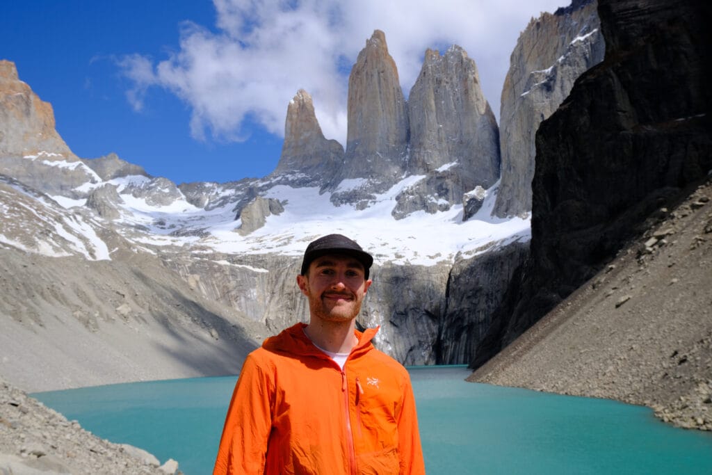 Male wearing orange Arc'teryx proton jacket at Mirador Base Torres