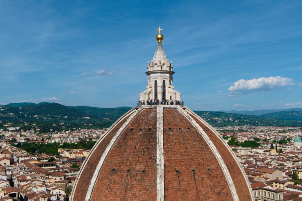 View of Duomo di Firenze from the Bell Tower on the Florence Cathedral with the city skyline and hills seen behind, captured on Fujifilm X-T30