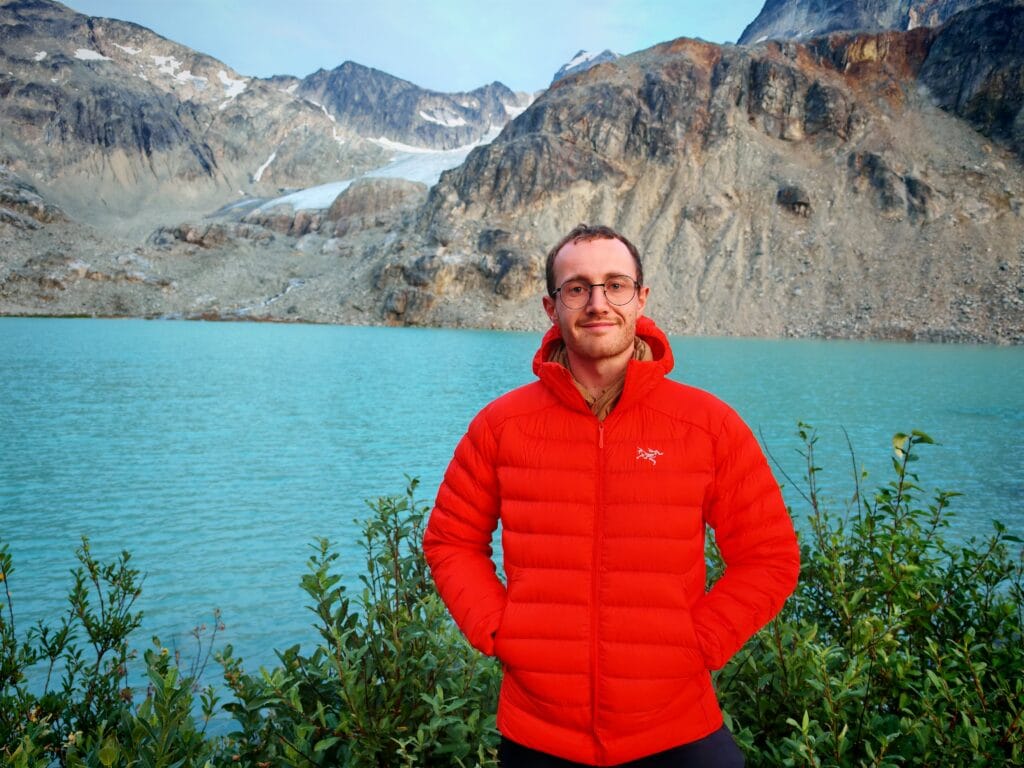 Men standing in front of wedgemount lake wearing the Arc'teryx Cerium Hoody