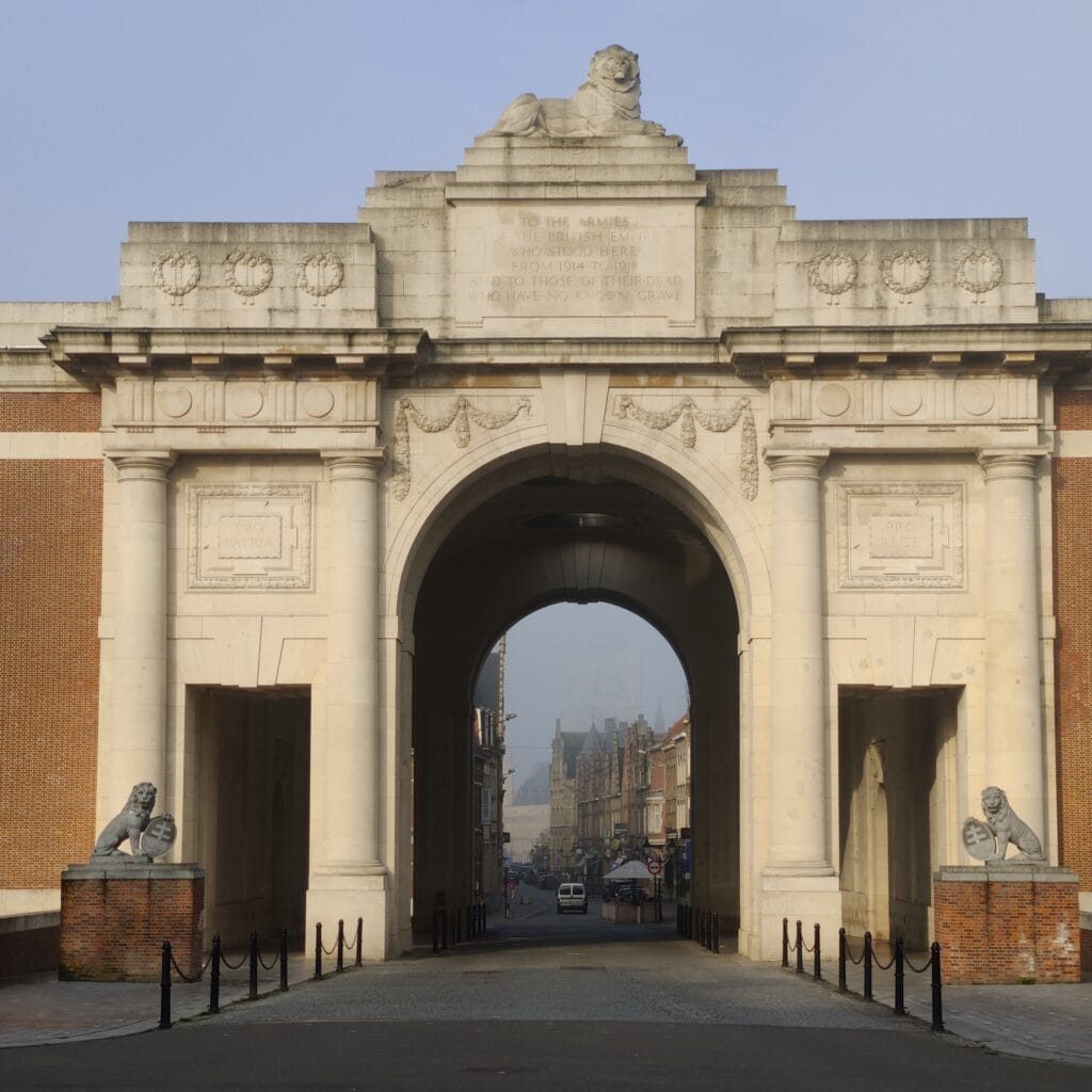 Morning view of Menin Gate with the Ypres Cloth Hall in the background