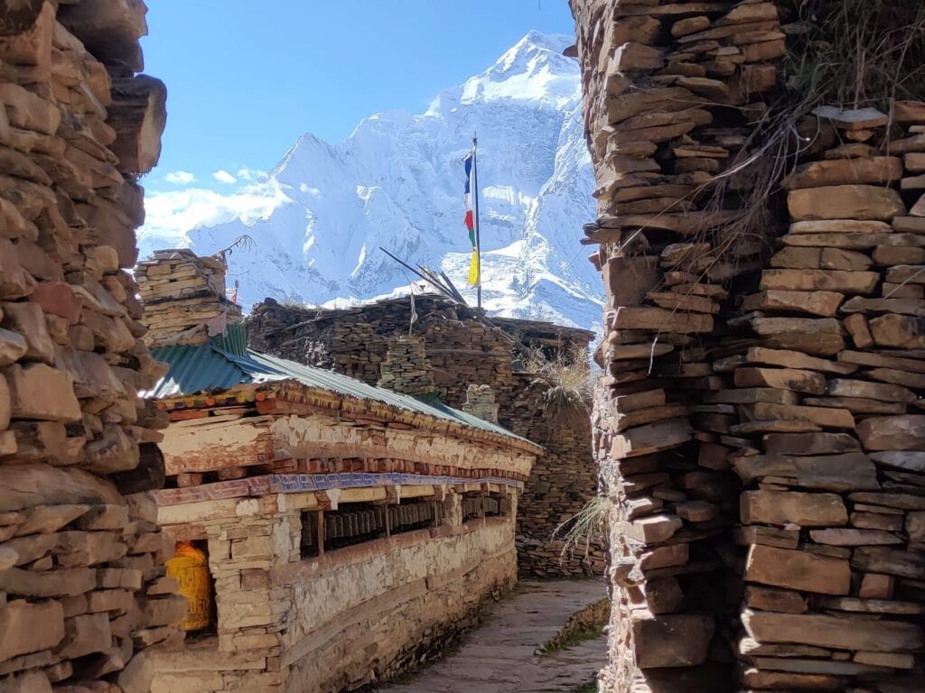 Ancient stone and wooden Nepalese village with narrow paths for trekkers to navigate on the Annapurna Circuit Trek