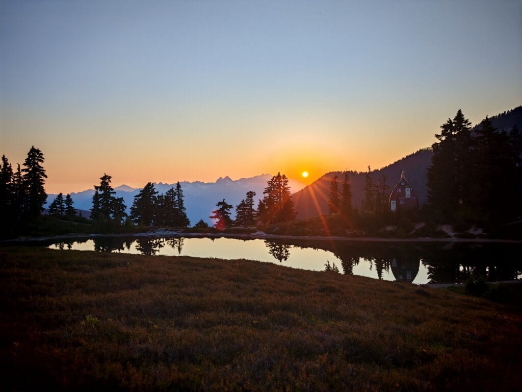 Elfin lakes sunset over the Talanus Range and lk=akes with tree silhouette
