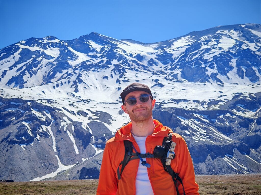 Hiker carrying the Fujifilm X-T30 on a Peak Design Capture Clip in the Andes