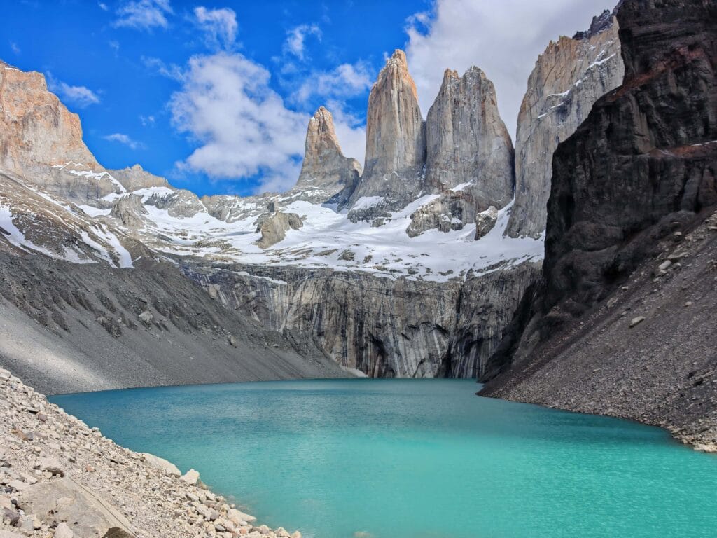 Mirador Base Torres on the iconic Torres del Paine W Trek and O Circuit in Patagonia with turqouise waters and rocky granite towers above