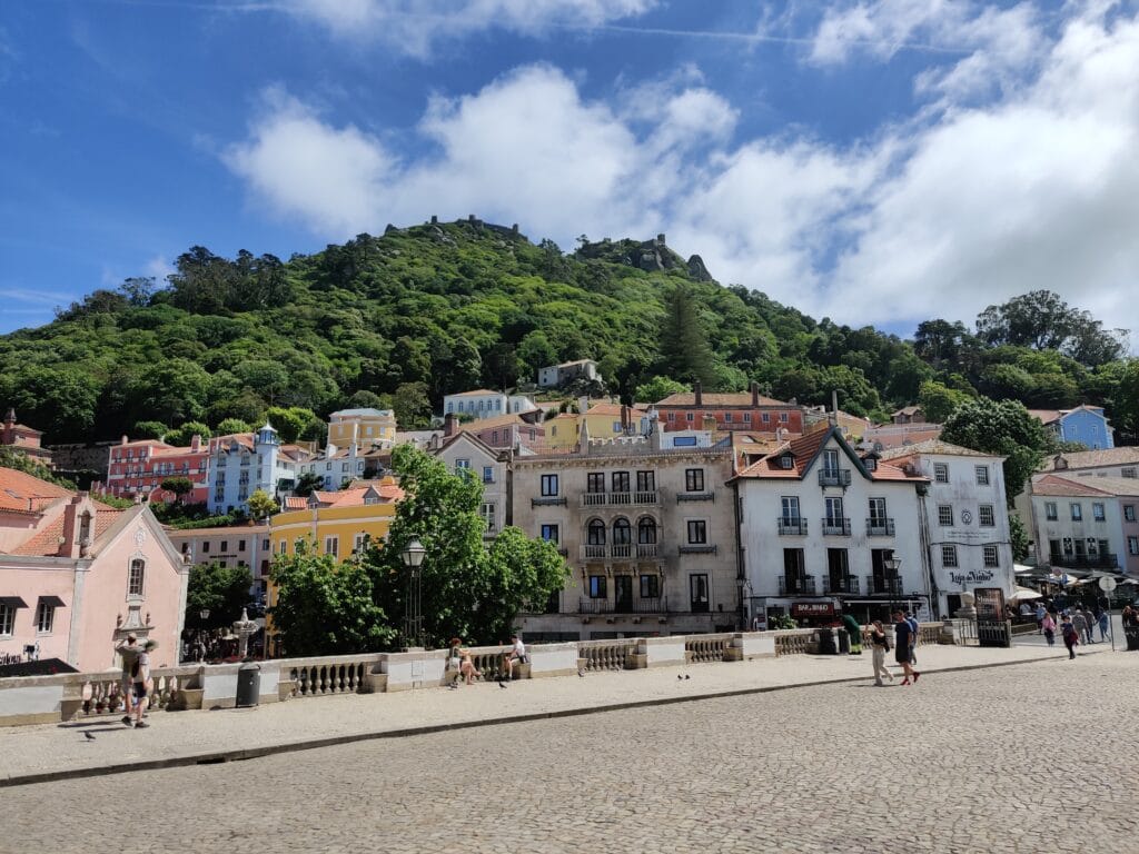 The sintra town streets as seen from the Palace of Sintra with the Moorish Castle perched on the hill above