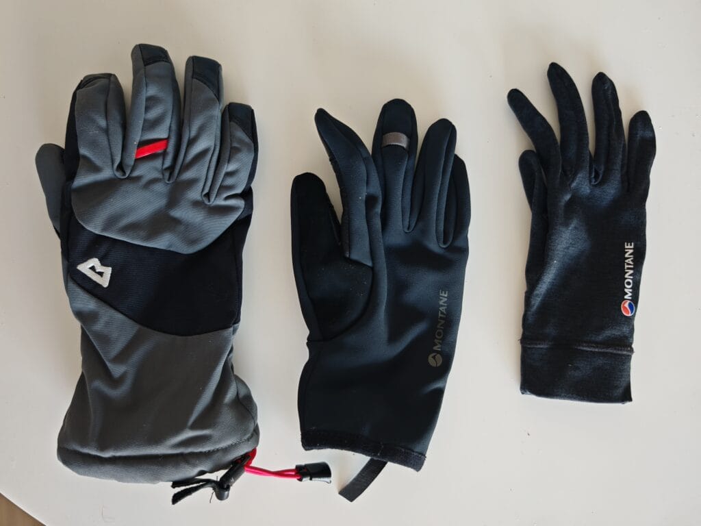 Glove comparison of Mountain Equipment Guide Glove left, Montane Windjammer middle and Montane Dart Glove liner right
