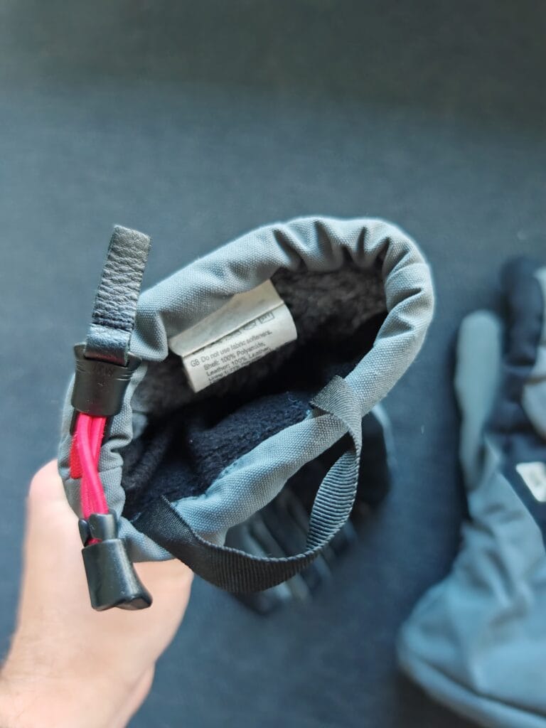 Inside view of the soft lining in the Mountain Equipment Guide Glove being held