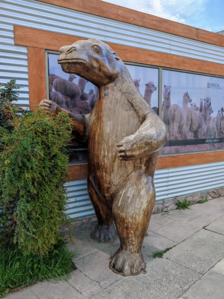 Mylodon wooden sculpture showing the size of the extinct giant sloth in Puerto Natales