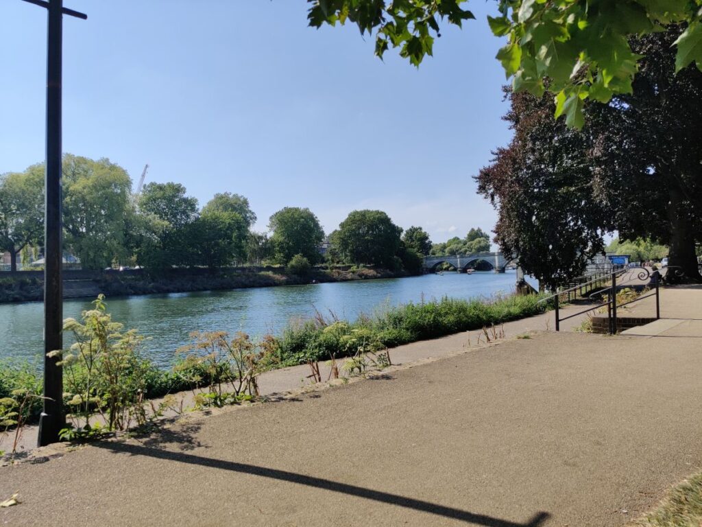 The Thames towpath by Richmond Bridge and riverside on a summers day